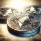 three coins with ethereum logo printed on them