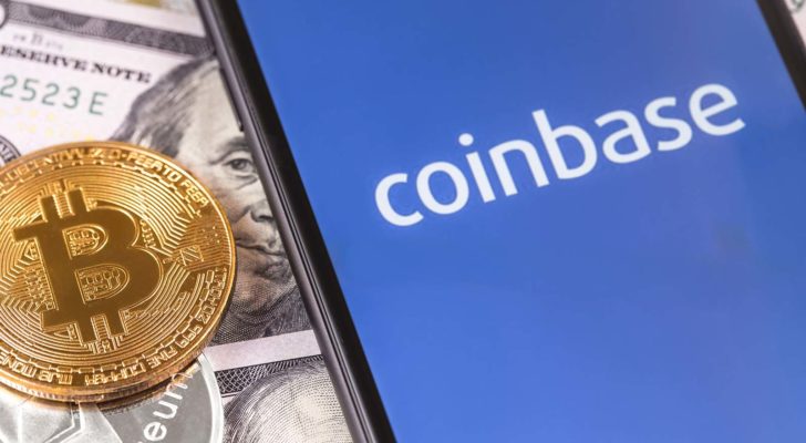 The Coinbase (COIN stock) logo on a smartphone screen with a BTC token. Crypto winter is setting in.