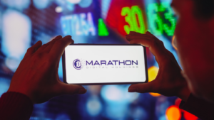 In this photo illustration the Marathon Digital Holdings (MARA) logo is displayed on a smartphone screen.