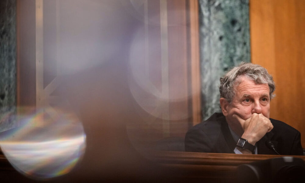 Committee chairman Sen. Sherrod Brown (D-OH) listens to testimony