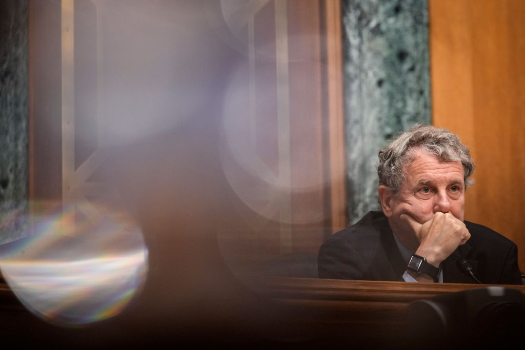 Committee chairman Sen. Sherrod Brown (D-OH) listens to testimony