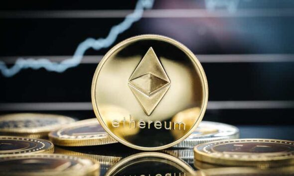 Ethereum cryptocurrency, physical coin close-up, in front of a price chart