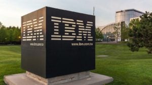 Quantum Computing Stock: IBM sign with Canada Head Office Building in the background in Markham, Ontario, Canada. IBM is an American multinational technology corporation.